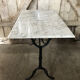 Old bistro table pied fer wrought black + white marble top vintage