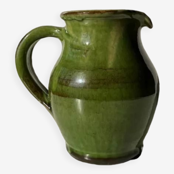 Green glazed ceramic pitcher