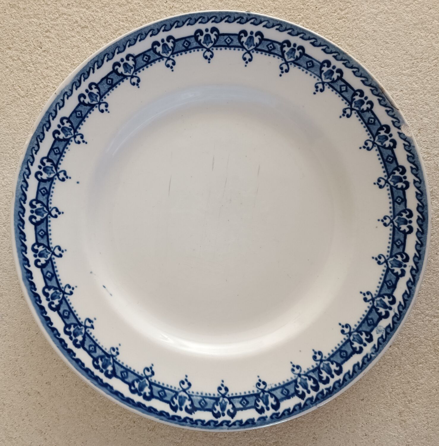 2 mismatched ironstone plates