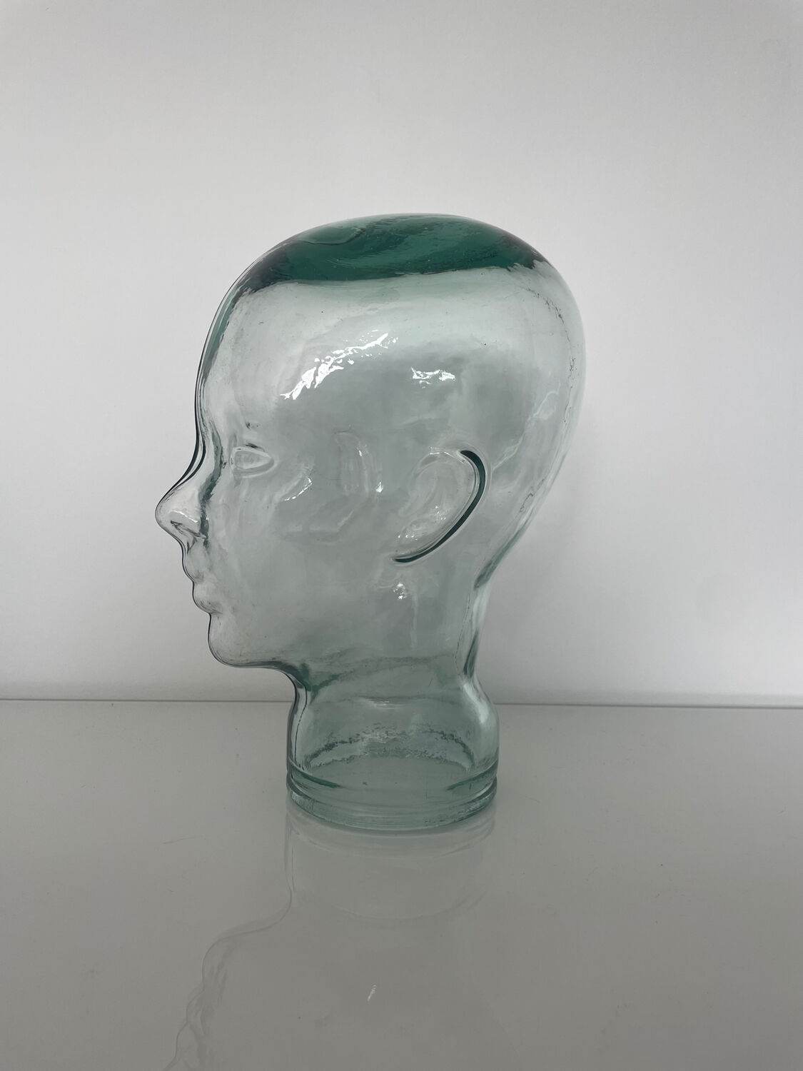 Mannequin head with glass hat