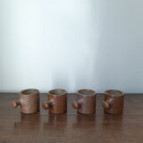 Lot of 4 cups in brown sandstone