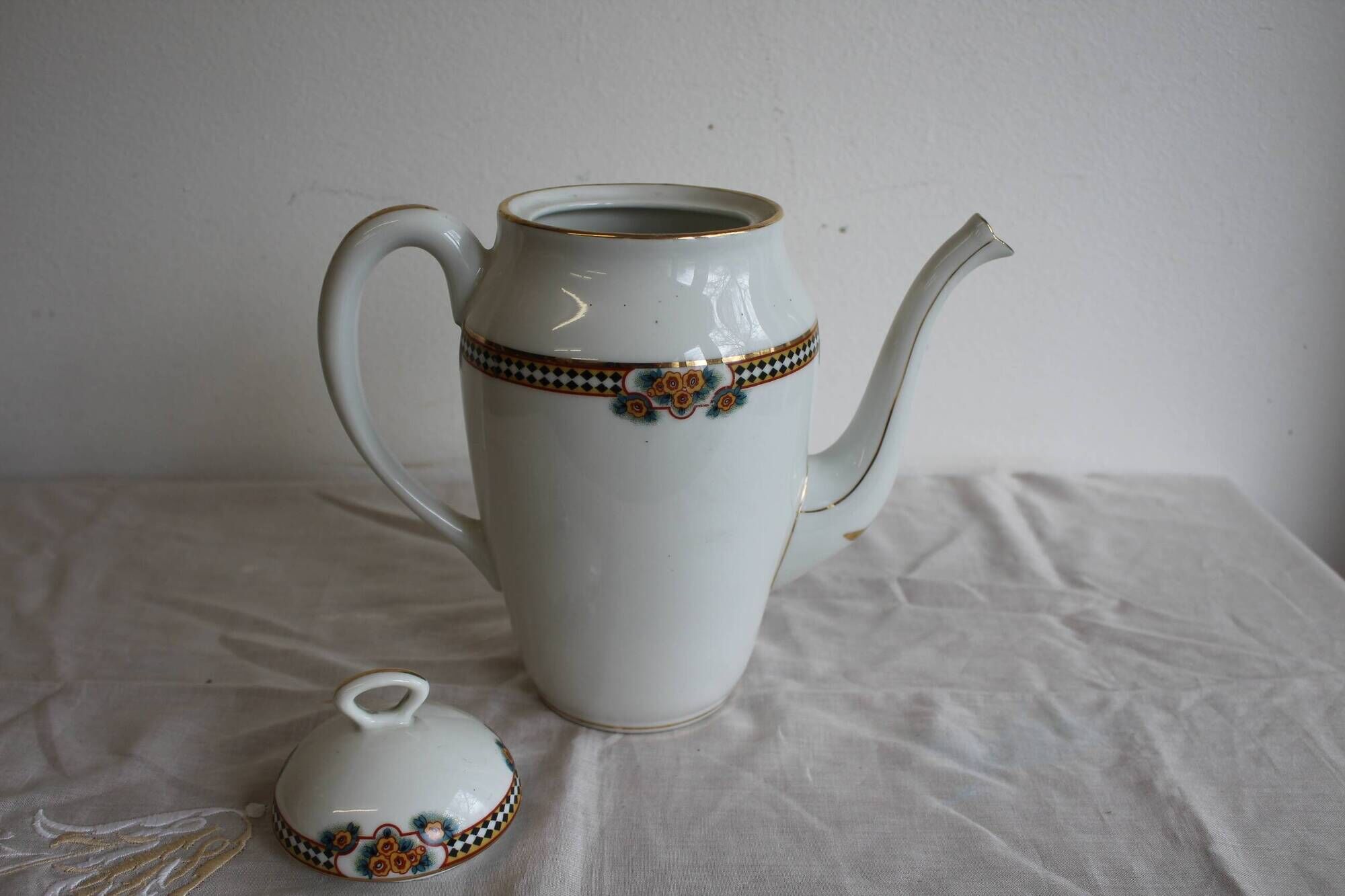 Antique coffee pot in white Limoges porcelain with floral motifs