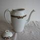 Antique coffee pot in white Limoges porcelain with floral motifs