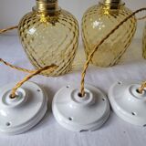 Trio of yellow glass pendant lights