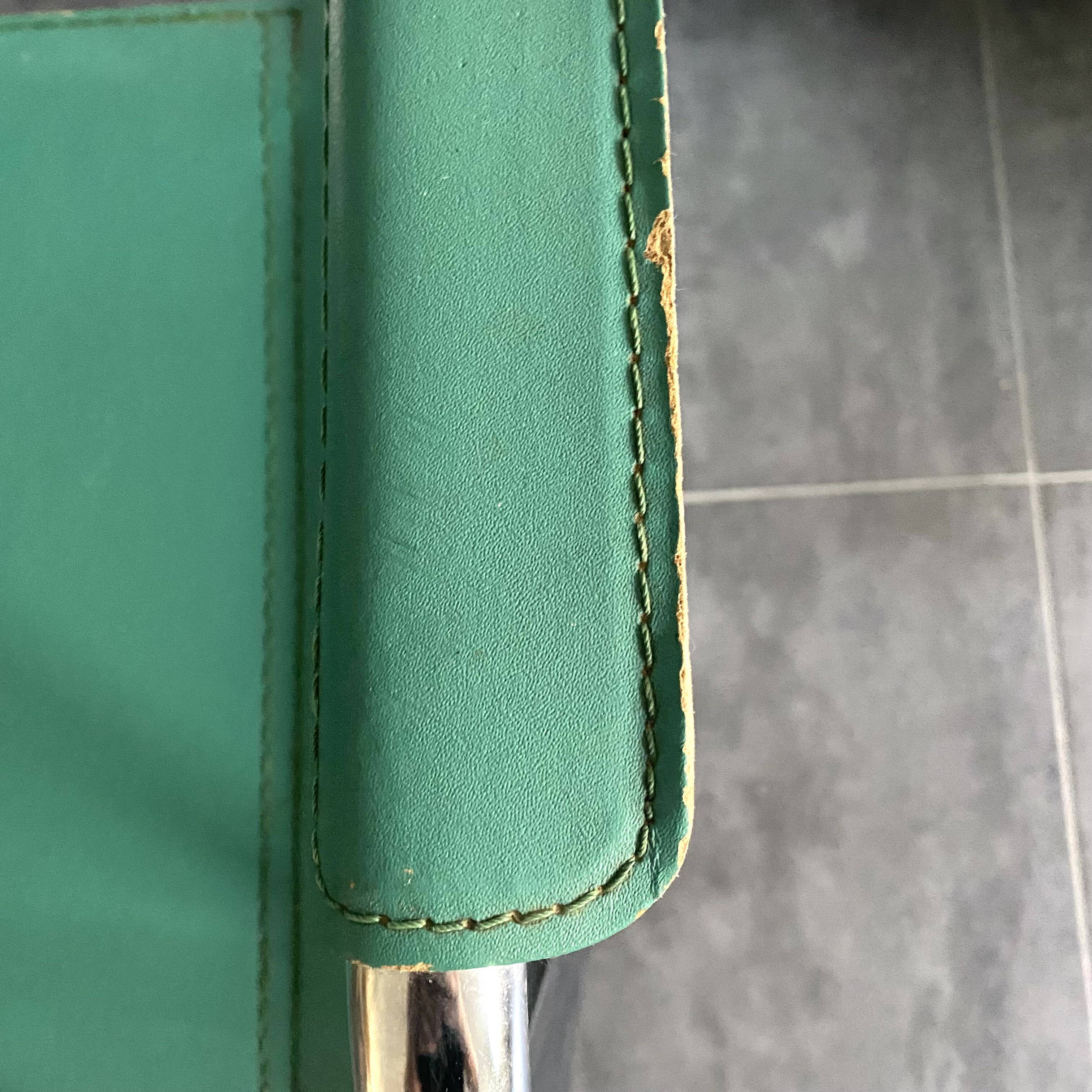 Pair of faux leather and chrome armchairs