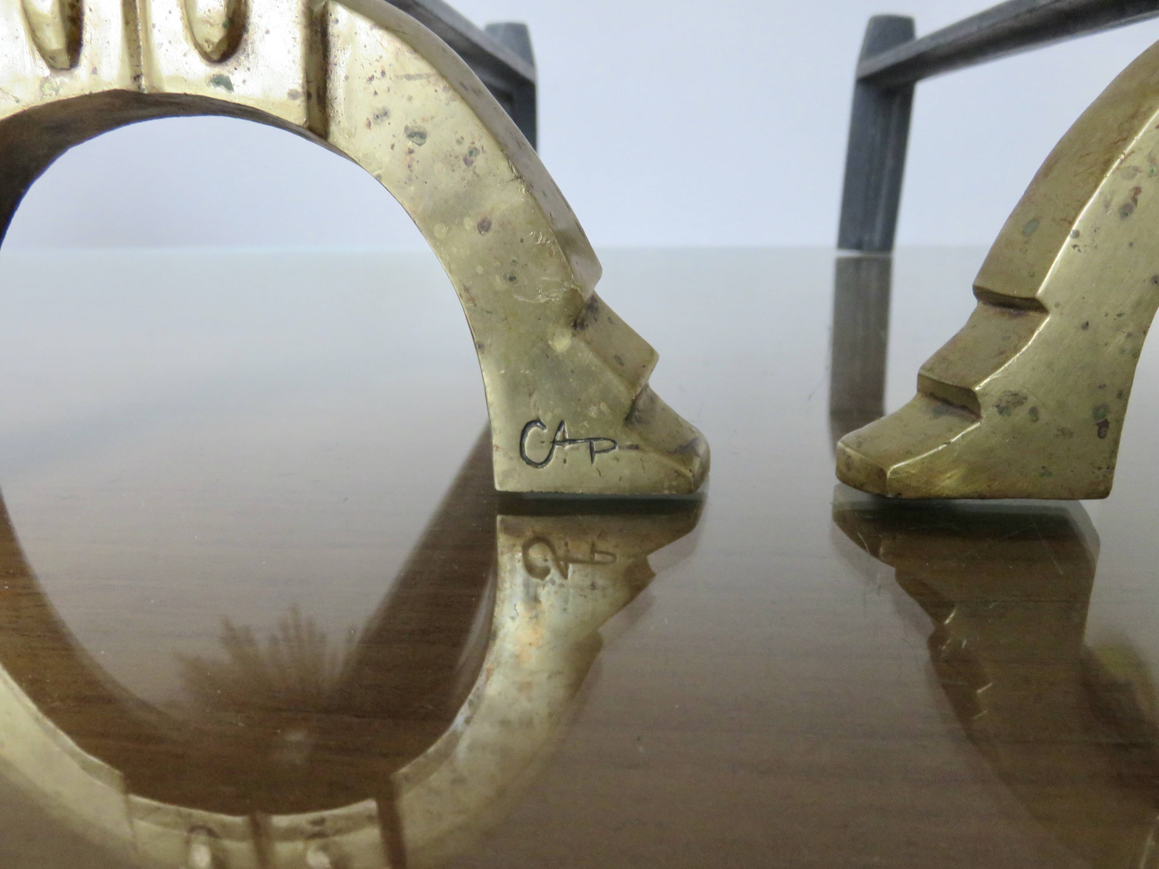 Anton Prinner, pair of Shaman fire dogs in gilded bronze, monogrammed, 1930