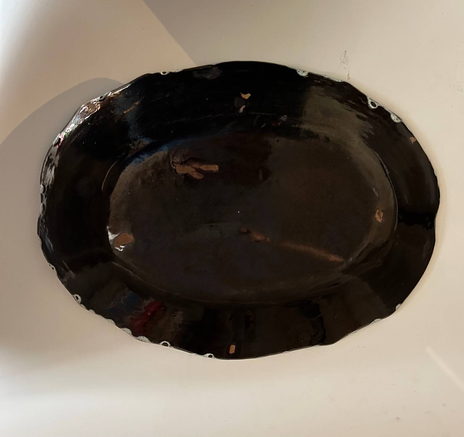 Large oval dish called “black bottom” Rouen XVIII / XIXth