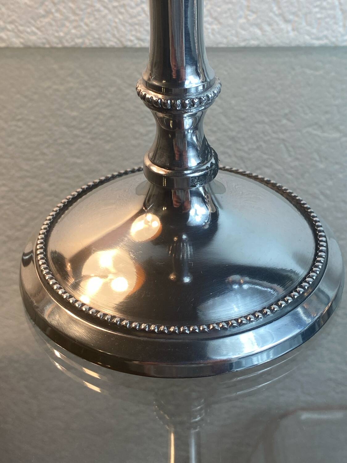 Pair of silver-plated metal candlesticks