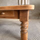 Antique solid wood coffee table – 2 drawers – turned legs