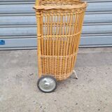 Vintage wicker log basket on vintage wheels