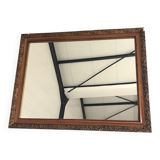Old mirror with wooden frame and plaster moldings