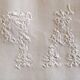 pair of AP monogram towels in cold linen