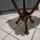 Coffee table with knotted wooden legs in an African pattern