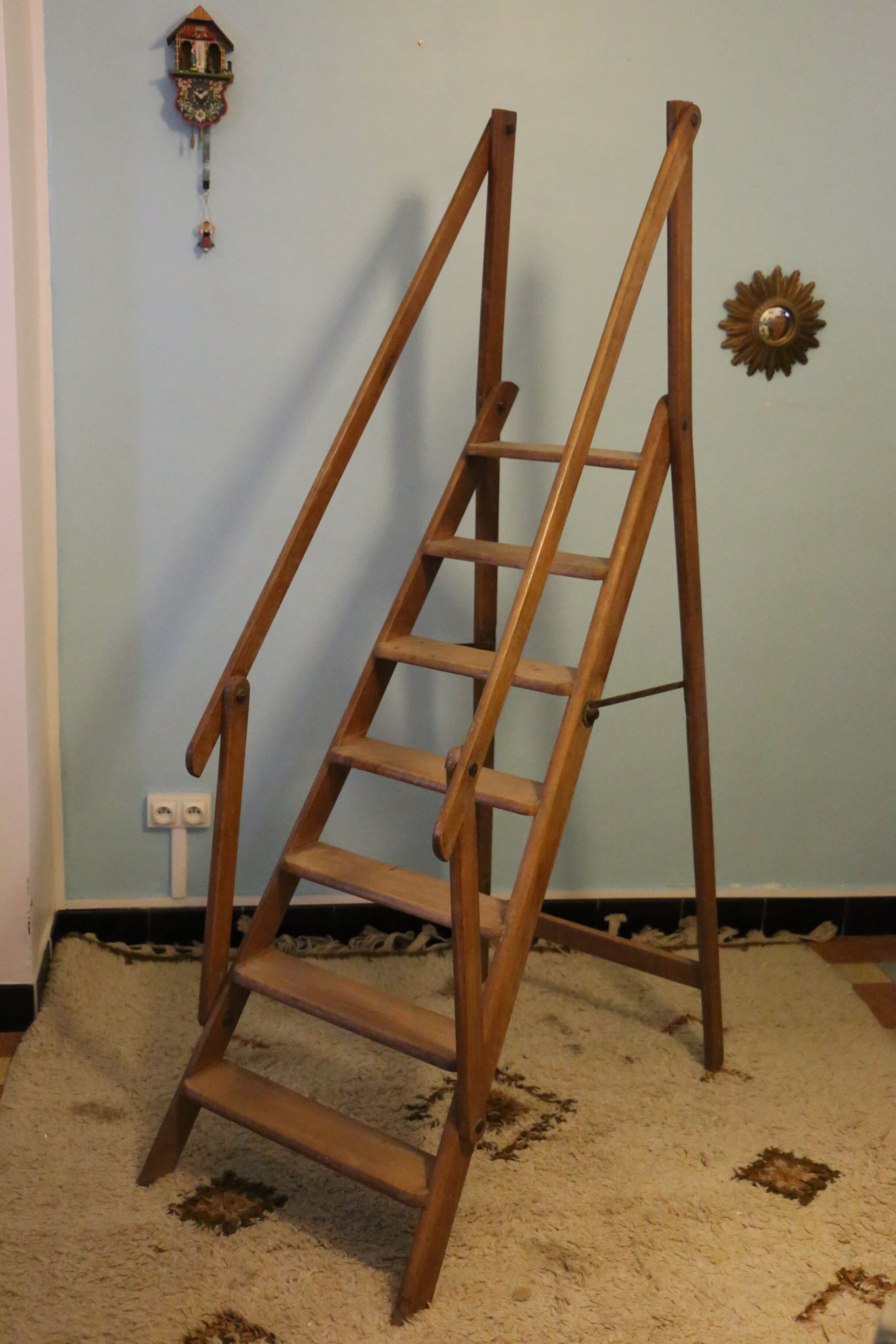 Old wooden stepladder with bodyguards