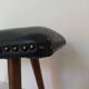 Dark blue leather stool with studs