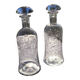 Two antique engraved glass bottles