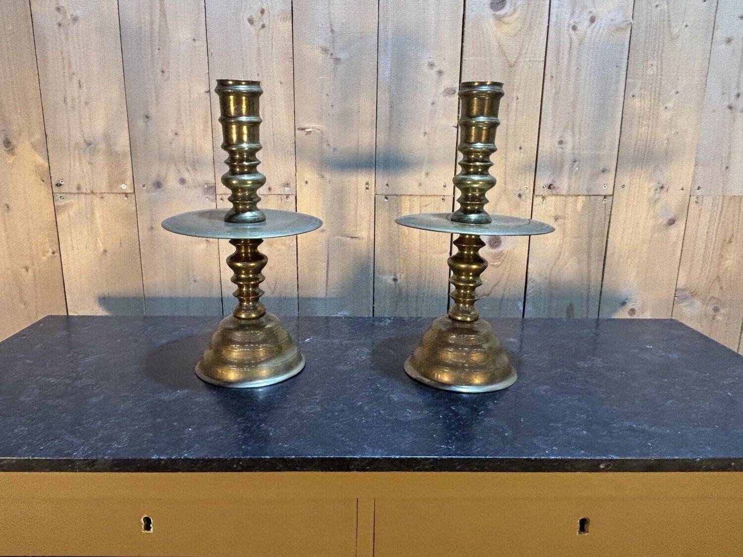 Pair of important brass candle holders