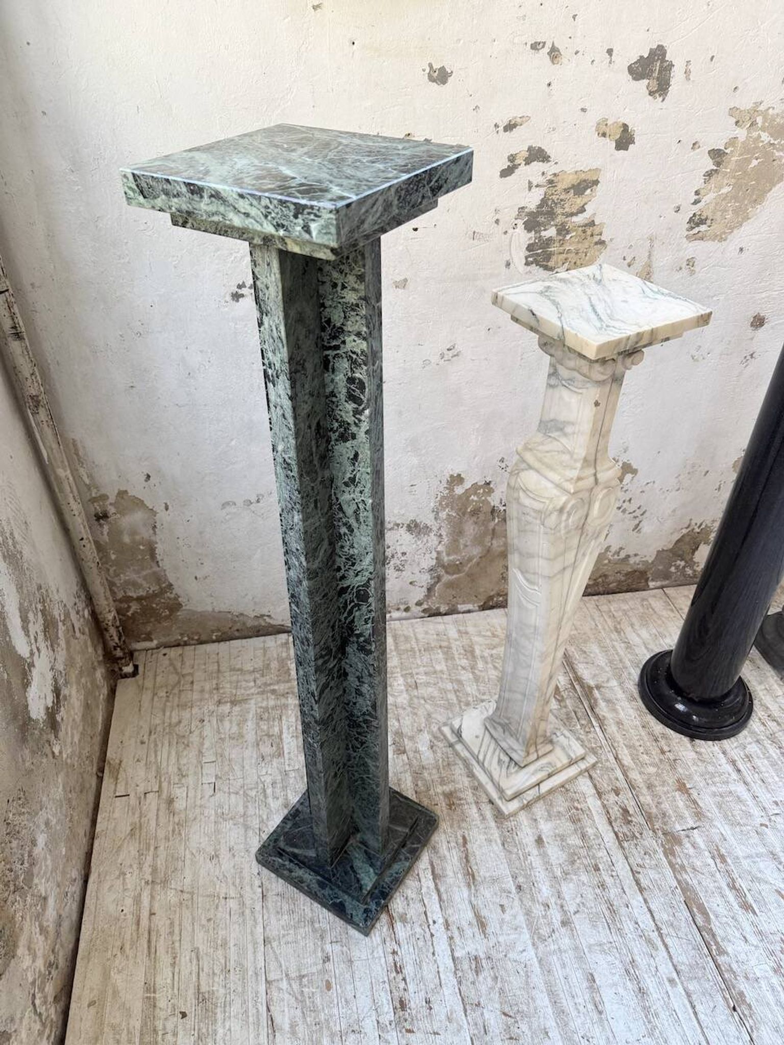 Set of 4 marble columns or pedestals.