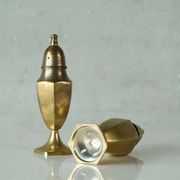 Pair of patinated brass salt and pepper shakers, 20th century.