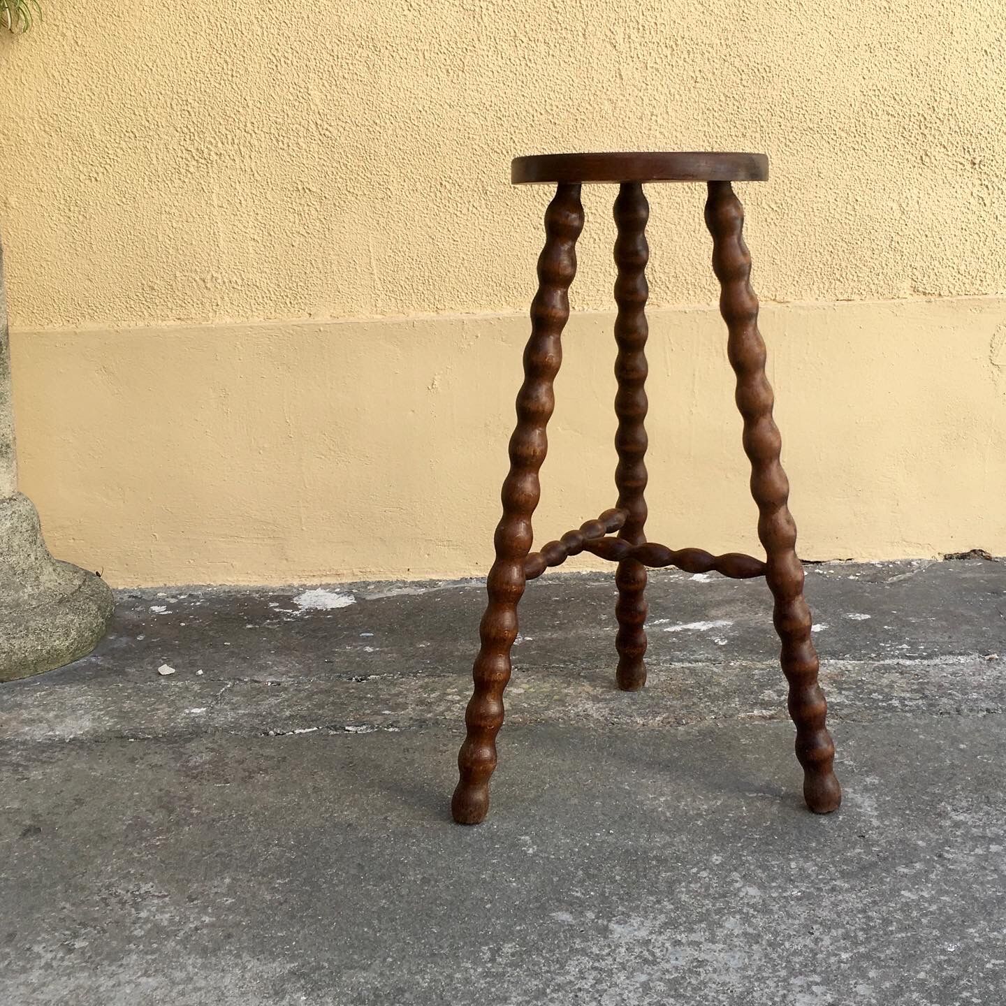 High tripod stool.
