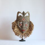 African mask with raffia and kaolin dots