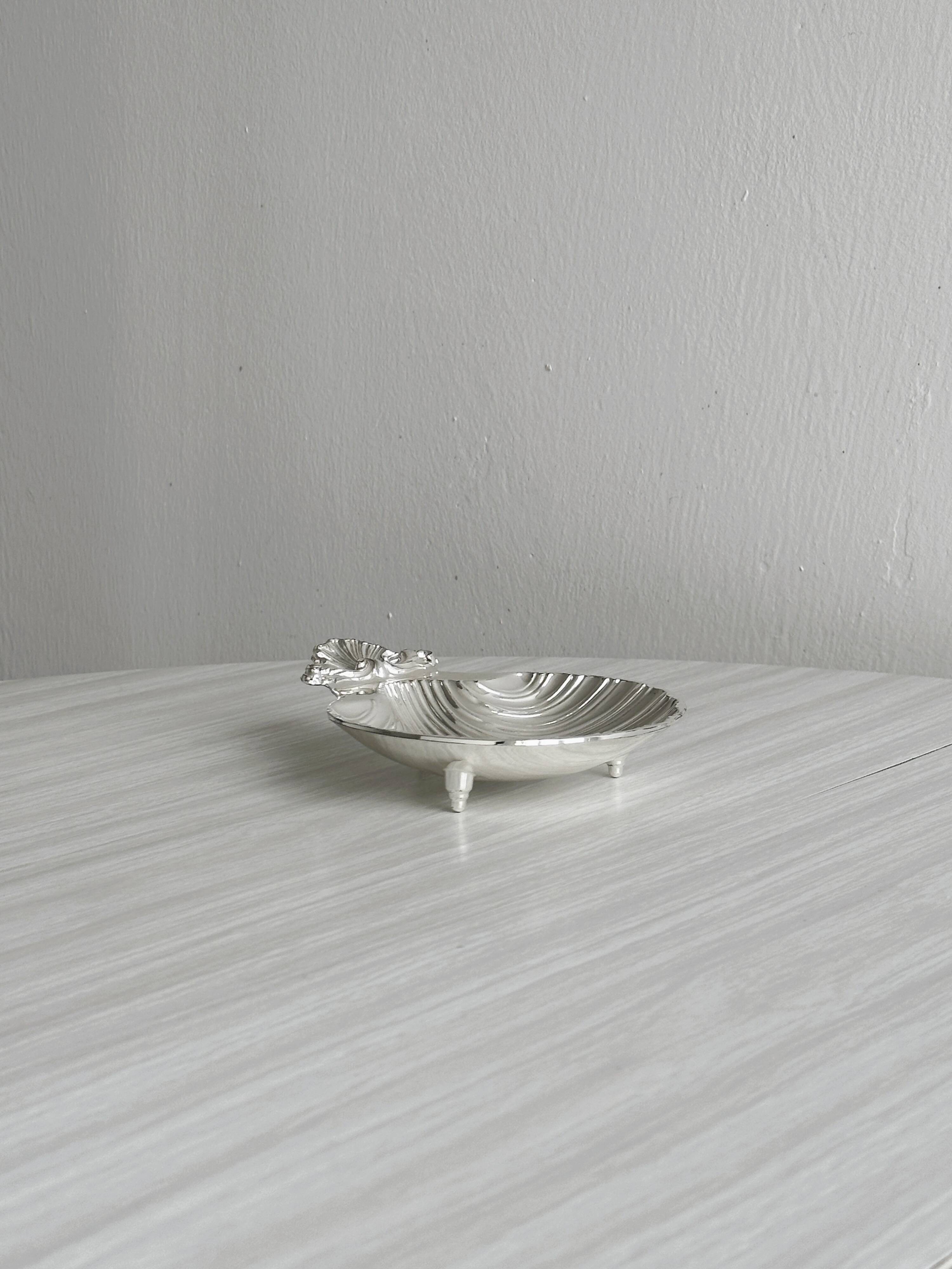 soap dish or jewelry holder in shiny metal