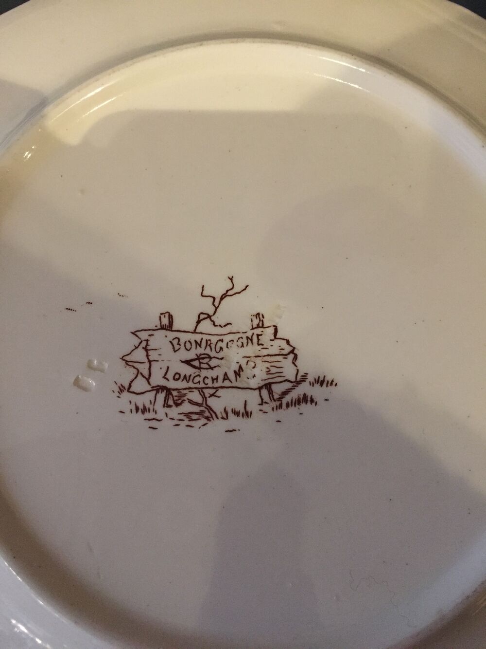 Suite of 9 flat plates in iron earth model burgundy longchamp decor hunting