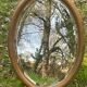 Bevelled golden oval mirror, 79 x 59 cm