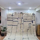 Modern Moroccan Beni Ouarain rug with blue geometric lines