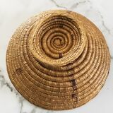 Large bowl on a woven wicker stand