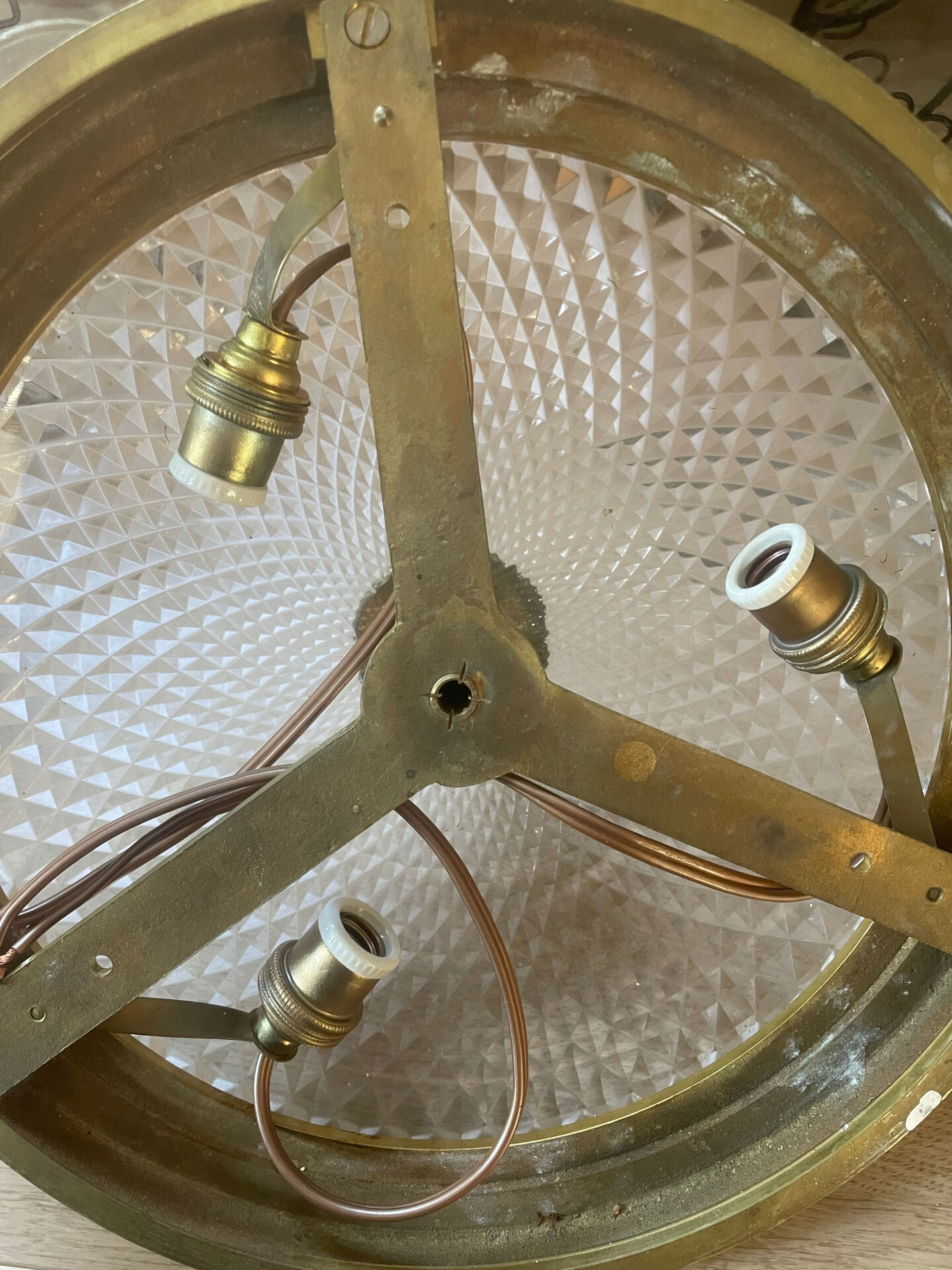 Antique ceiling light in bronze and cut crystal with diamond points.