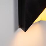 Architectural pair of vintage black metal wall lamps with angular geometric