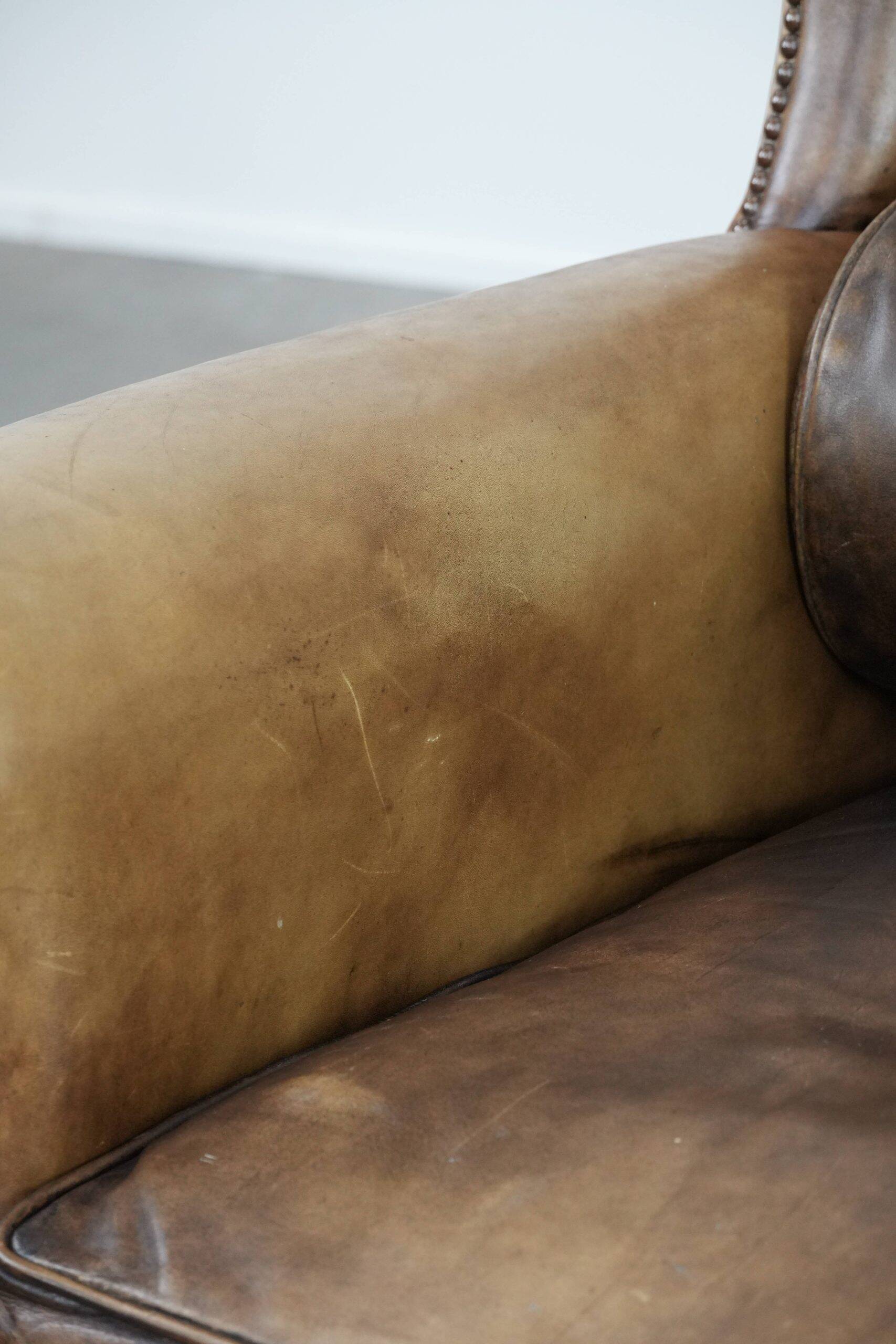 Luxury and large cowhide leather wingback chair in English style