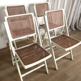 4 folding chairs with wicker seating