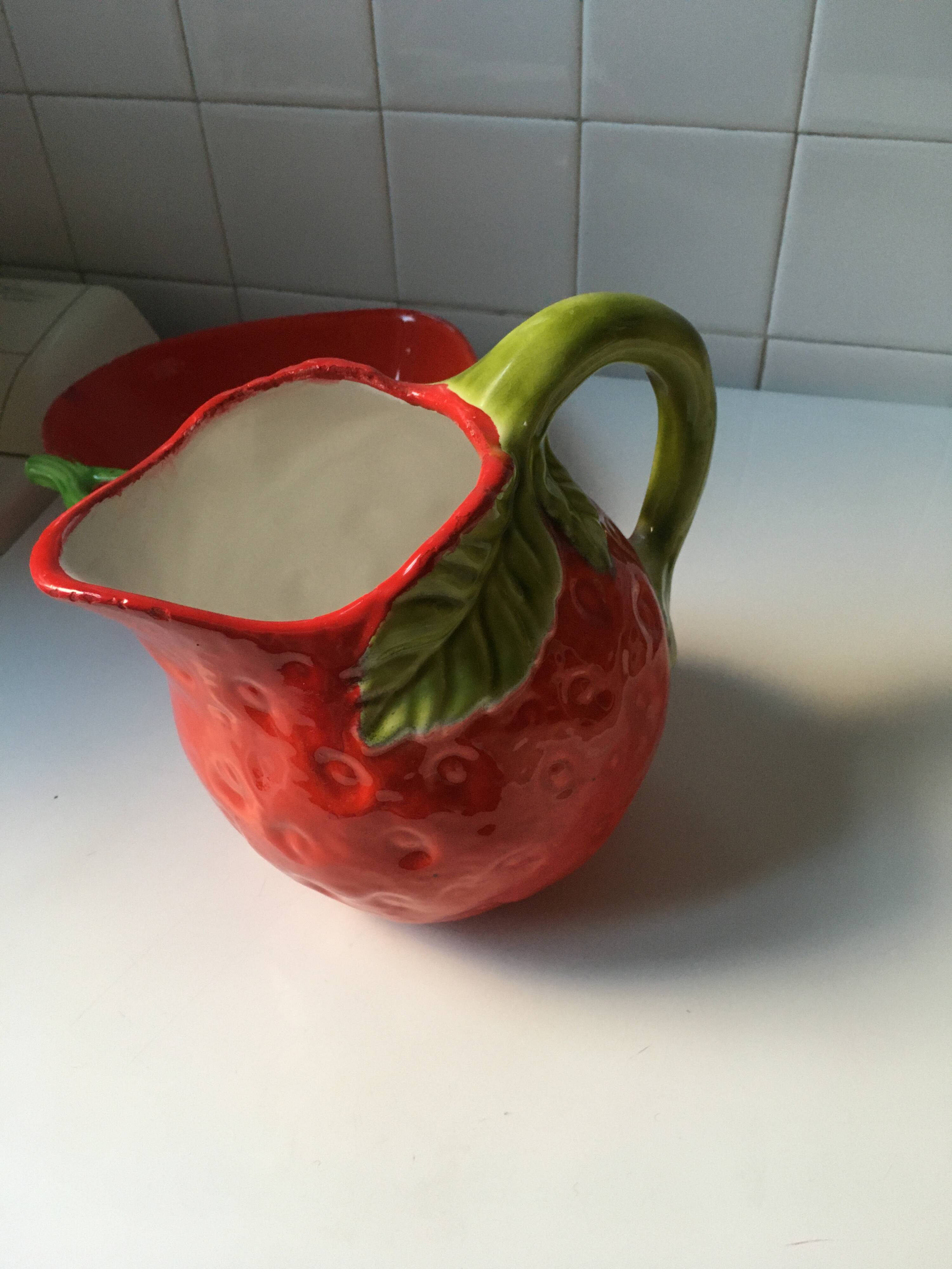 Strawberry-shaped pitcher with a dish