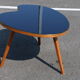 Bean coffee table with black glass top