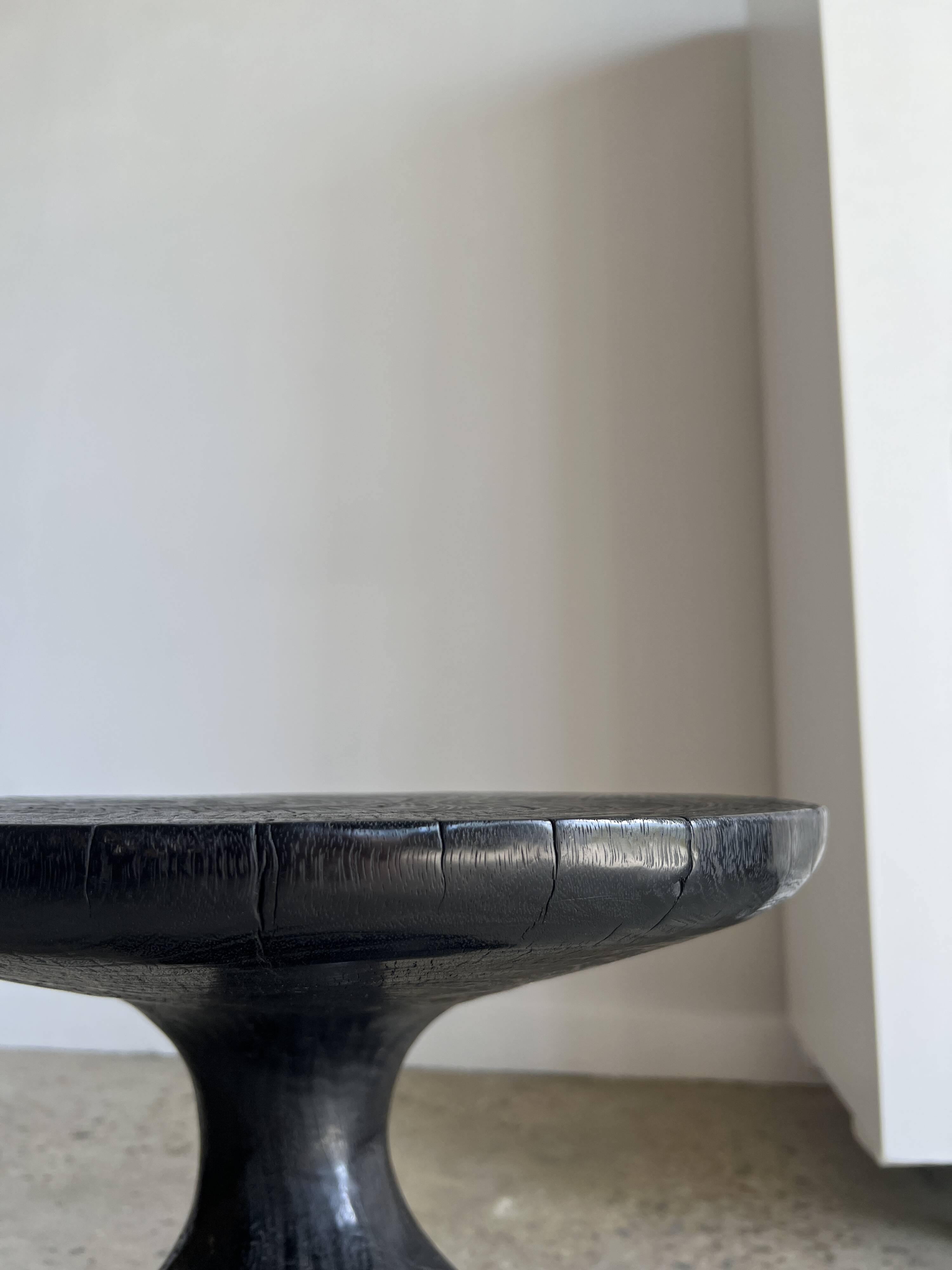 Solid wood (monoxyl) side table, organic shape, black color