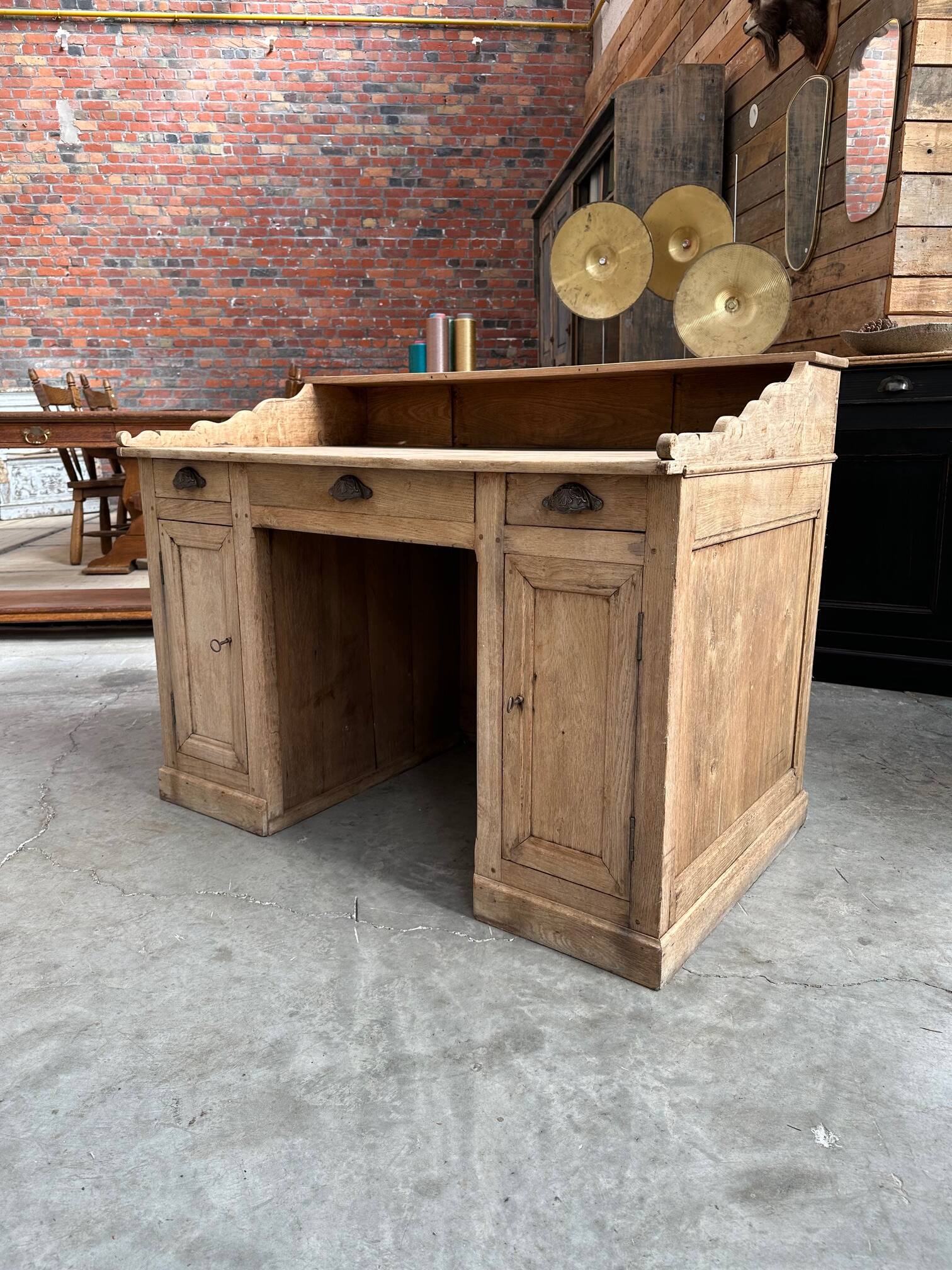 Solid oak reception desk, early 20th century