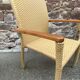 Pair of colonial-style rattan and wood armchairs