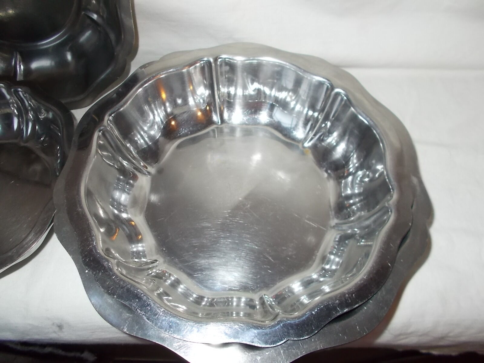 Lot of 4 round hollow stainless steel dishes