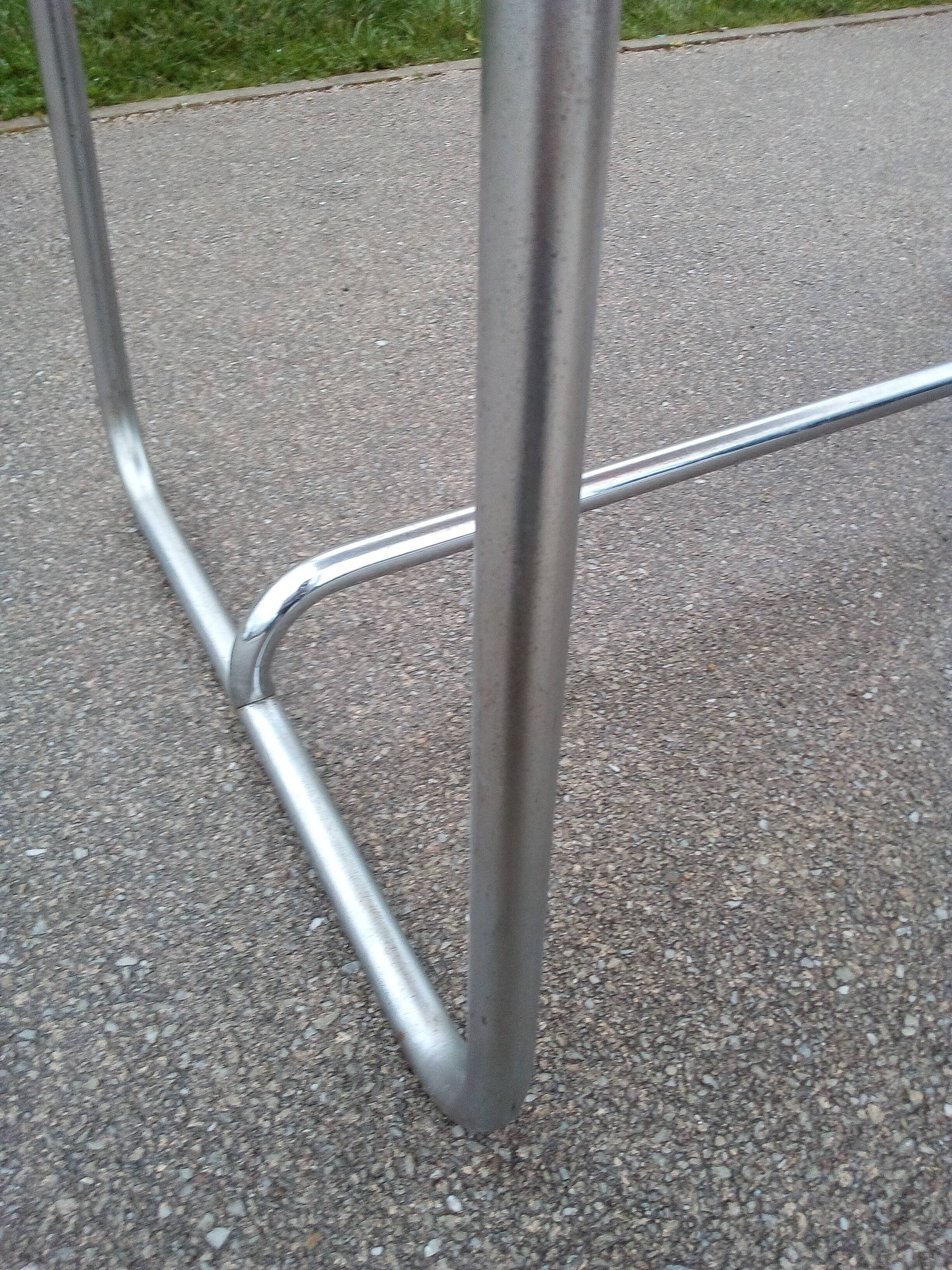 Old table in chrome steel and wood