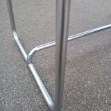 Old table in chrome steel and wood