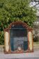 Wooden mirror with clock, 1960
