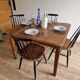 Square art deco dining table in solid wood