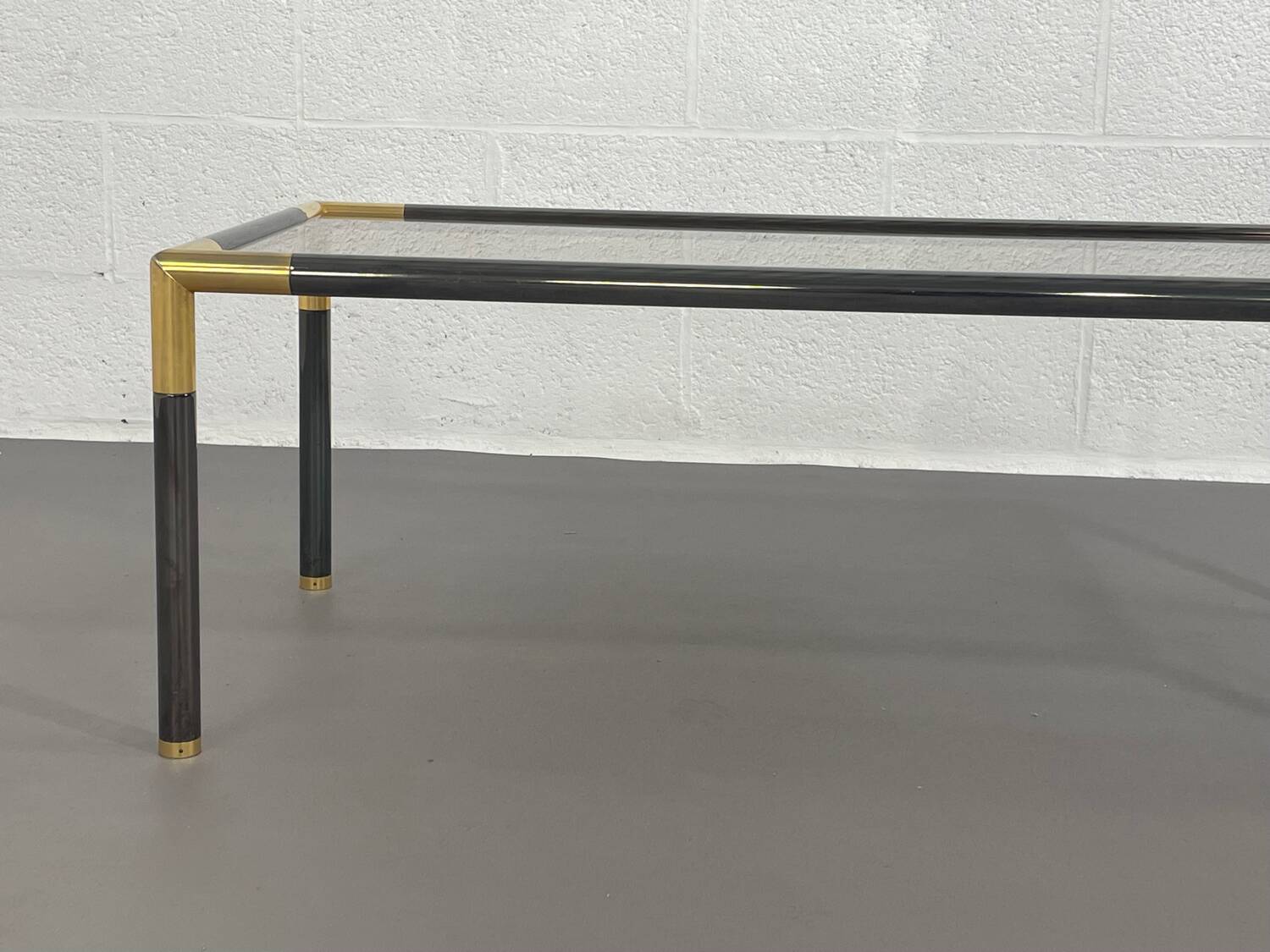 Gunmetal gold metal and smoked glass coffee table from the 70s