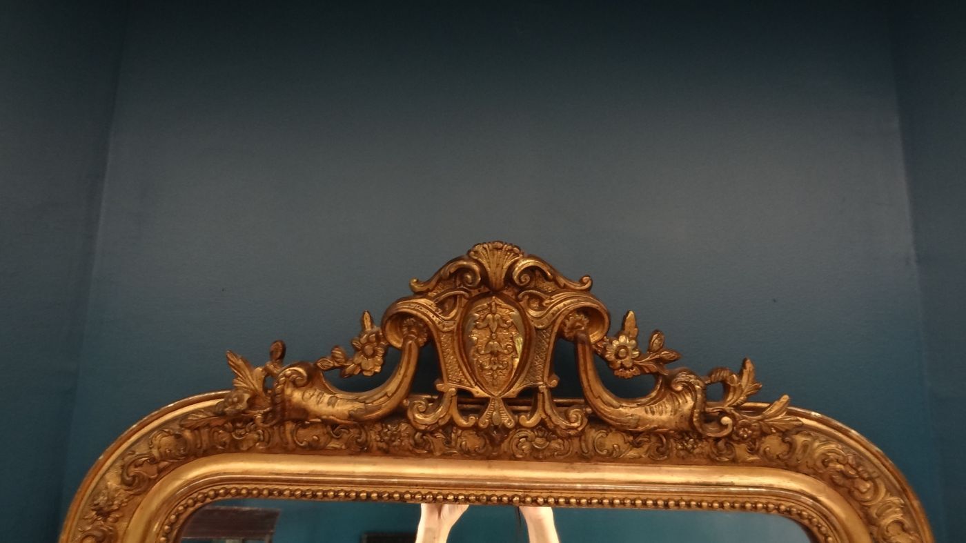 Mirror XIXth in gilded stucco, H 142 cm