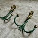 Rare set of swan neck coat hooks with mirror frame attributed to Maison Jansen, France, 1950s.