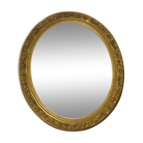Golden oval mirror