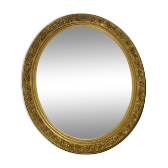 Golden oval mirror