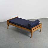 Wooden bench with midnight blue fabric, France, circa 1955